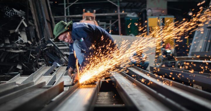 Man cutting stainless steel. Fabrication Stainless Steel