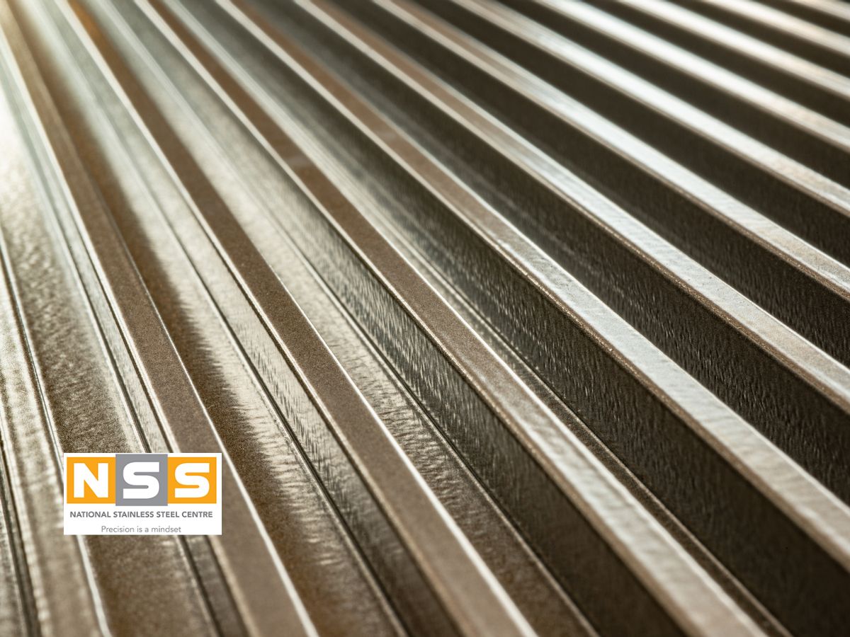 Stainless steel and mild steel sections side by side showing surface condition after exposure